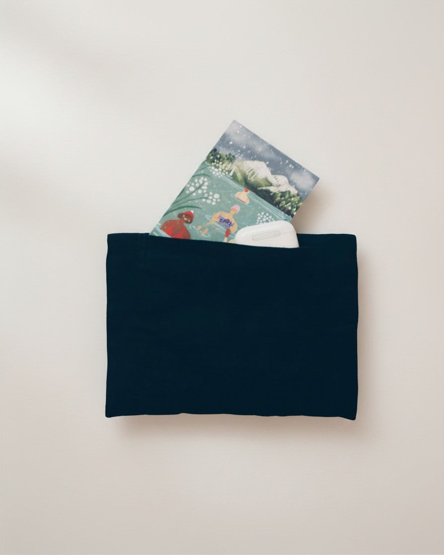 Hue Labs purple slate envelope clutch made from upcycled textiles with a deep pocket holding a card and earbuds.