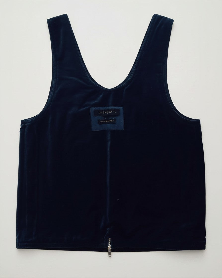 Hue Labs reversible blue vest bag made from upcycled materials featuring a silver metal zipper and brand patch