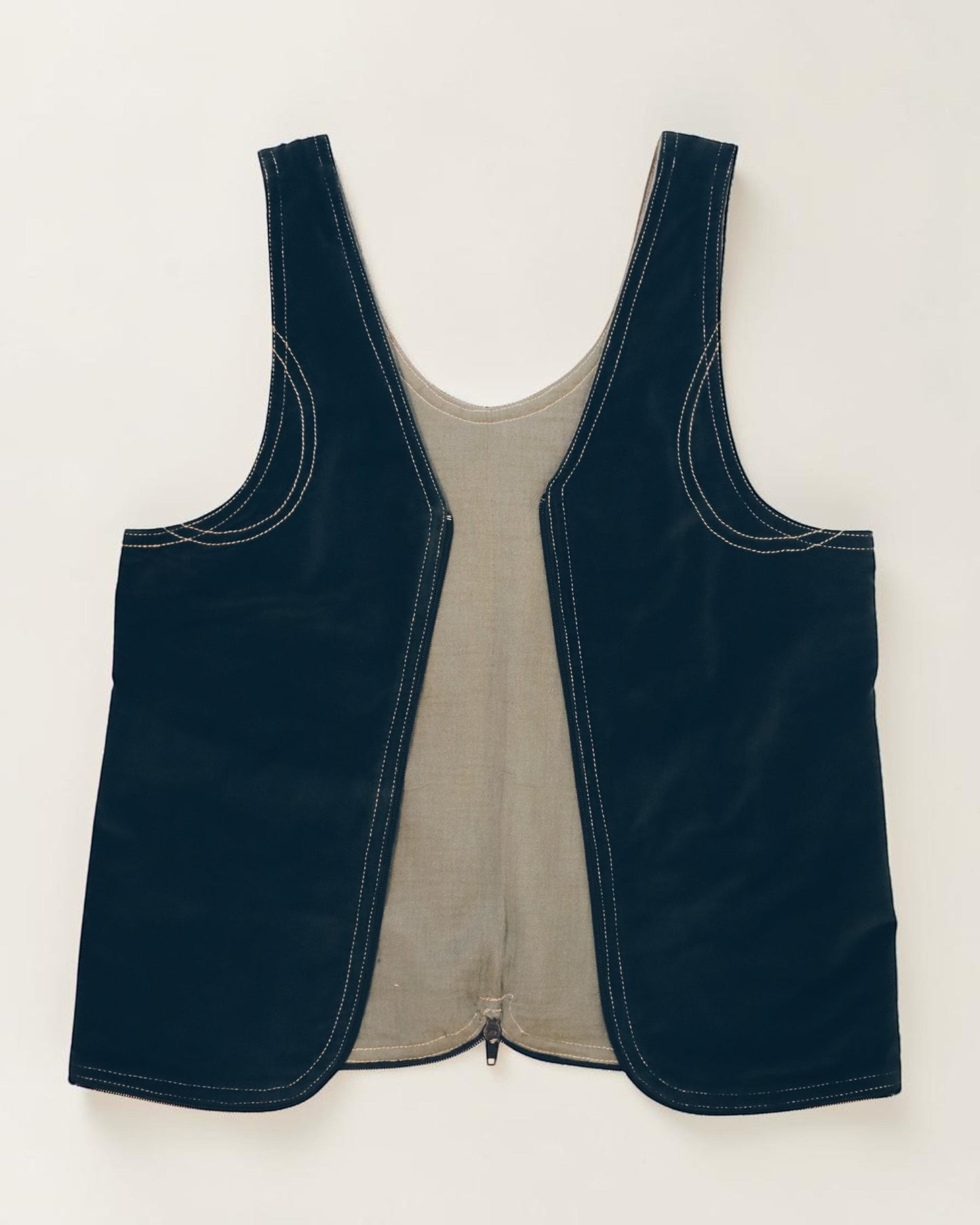 Hue Labs reversible Garden Vest Bag made from upcycled black and beige fabric with a gun metal silver zipper.