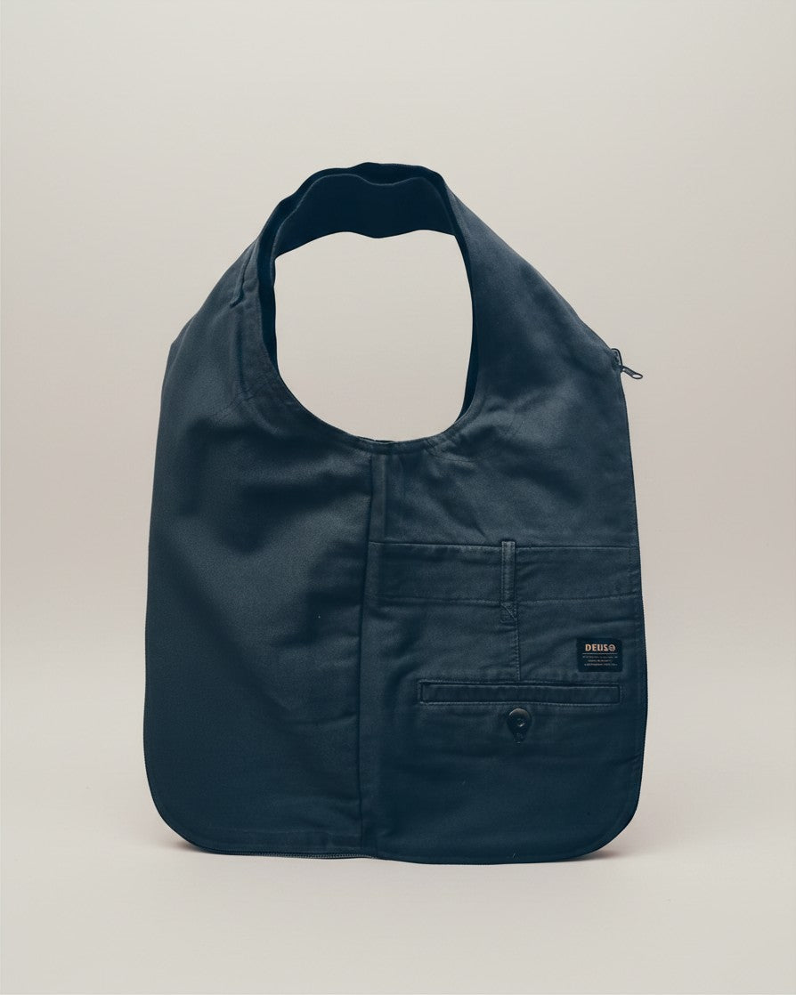 Hue Labs army green upcycled vest bag with a gun metal zipper, featuring a versatile reversible design.
