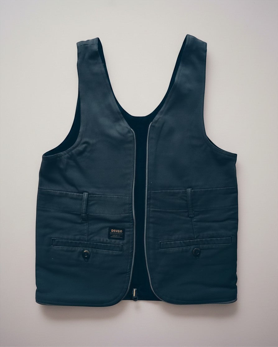 Hue Labs army green upcycled vest bag with a gun metal silver zipper, shown as a versatile reversible garment.