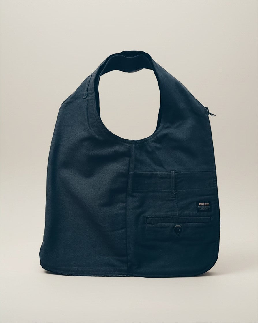 Hue Labs reversible army green vest bag made from upcycled materials with a gun metal zipper and front pocket