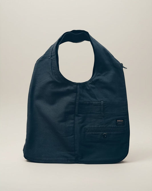 Hue Labs reversible army green vest bag made from upcycled materials with a gun metal zipper and front pocket