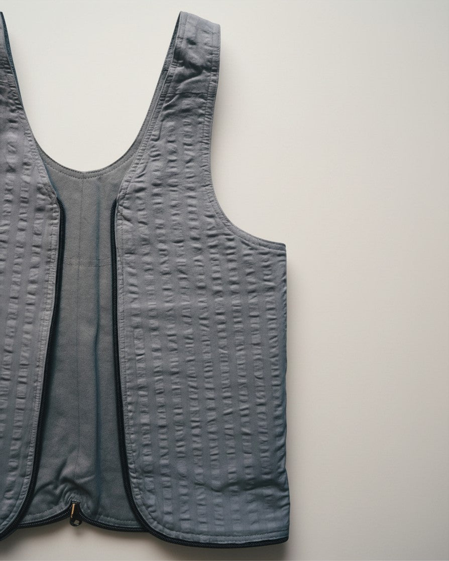 Hue Labs Ash Vest Bag in grey, a reversible upcycled garment that converts into a functional bag with a metal zipper.
