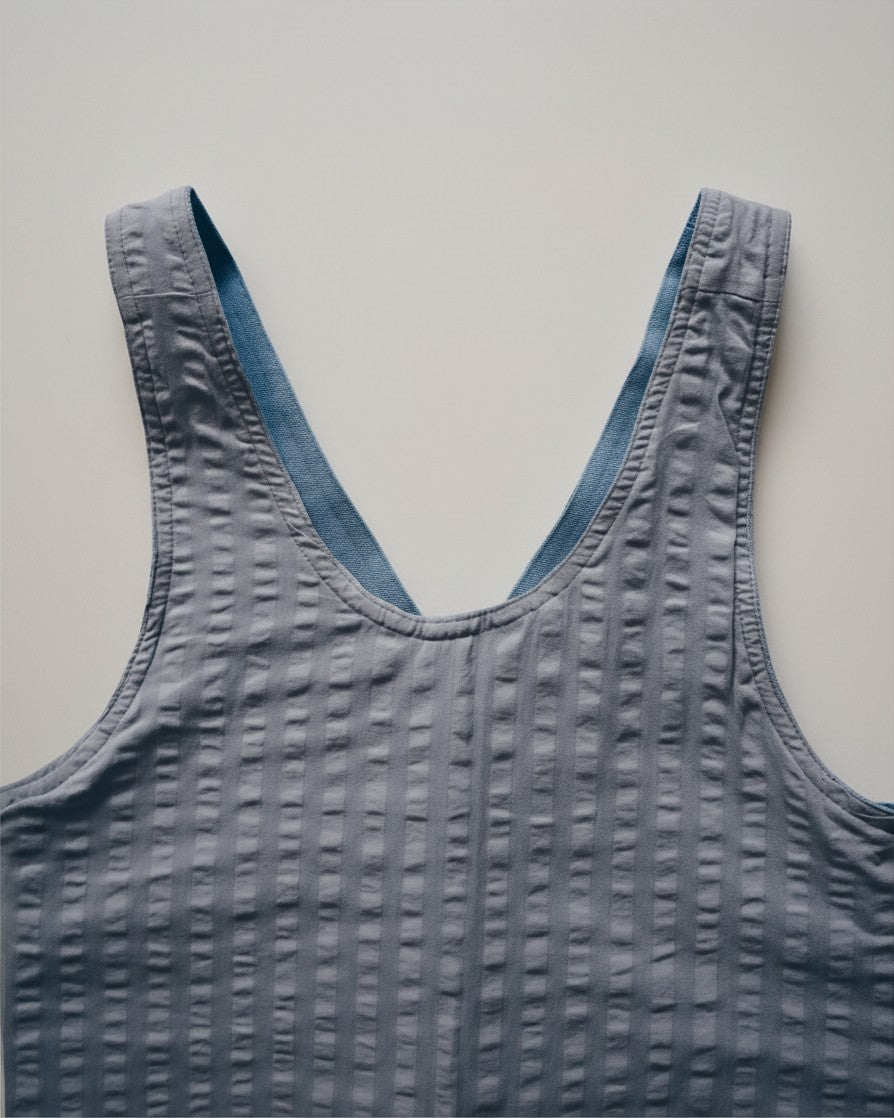 Hue Labs baby blue reversible vest bag made from upcycled textured fabric with a deep V-neckline
