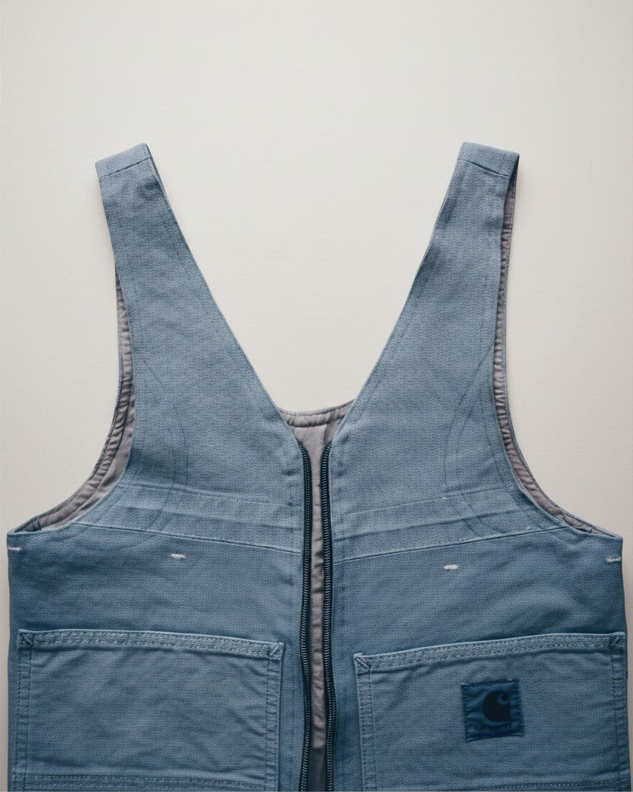 Hue Labs baby blue reversible vest bag made from upcycled materials with a gun metal silver zipper and front pockets.