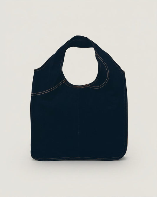 Hue Labs reversible black denim vest bag handcrafted from upcycled materials with a gun metal silver zipper.
