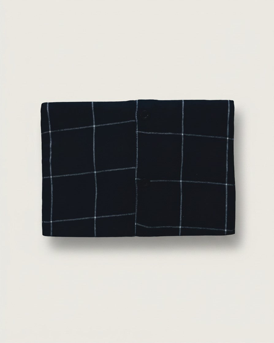 Hue Labs blue checkered envelope clutch made from sustainable upcycled textiles with a magnetic snap closure.