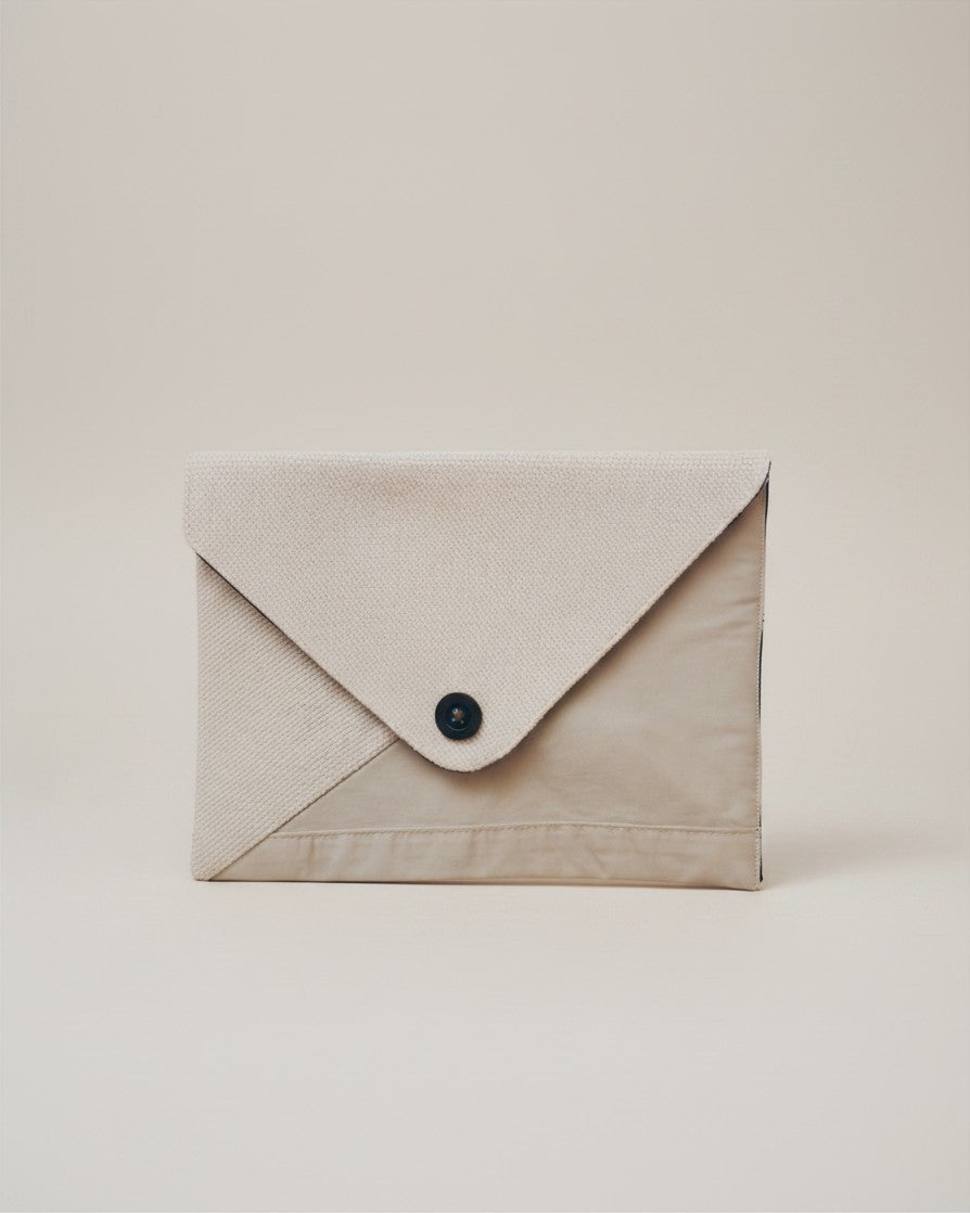 Hue Labs Earth Tones II envelope clutch bag made from upcycled beige and cream textiles with a magnetic snap closure.