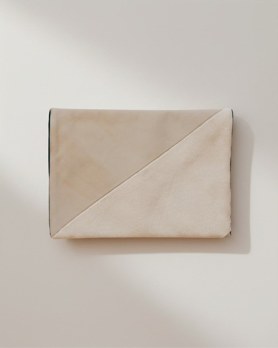 Hue Labs Earth Tones III envelope clutch in beige upcycled textile with a diagonal textured panel and magnetic snap.