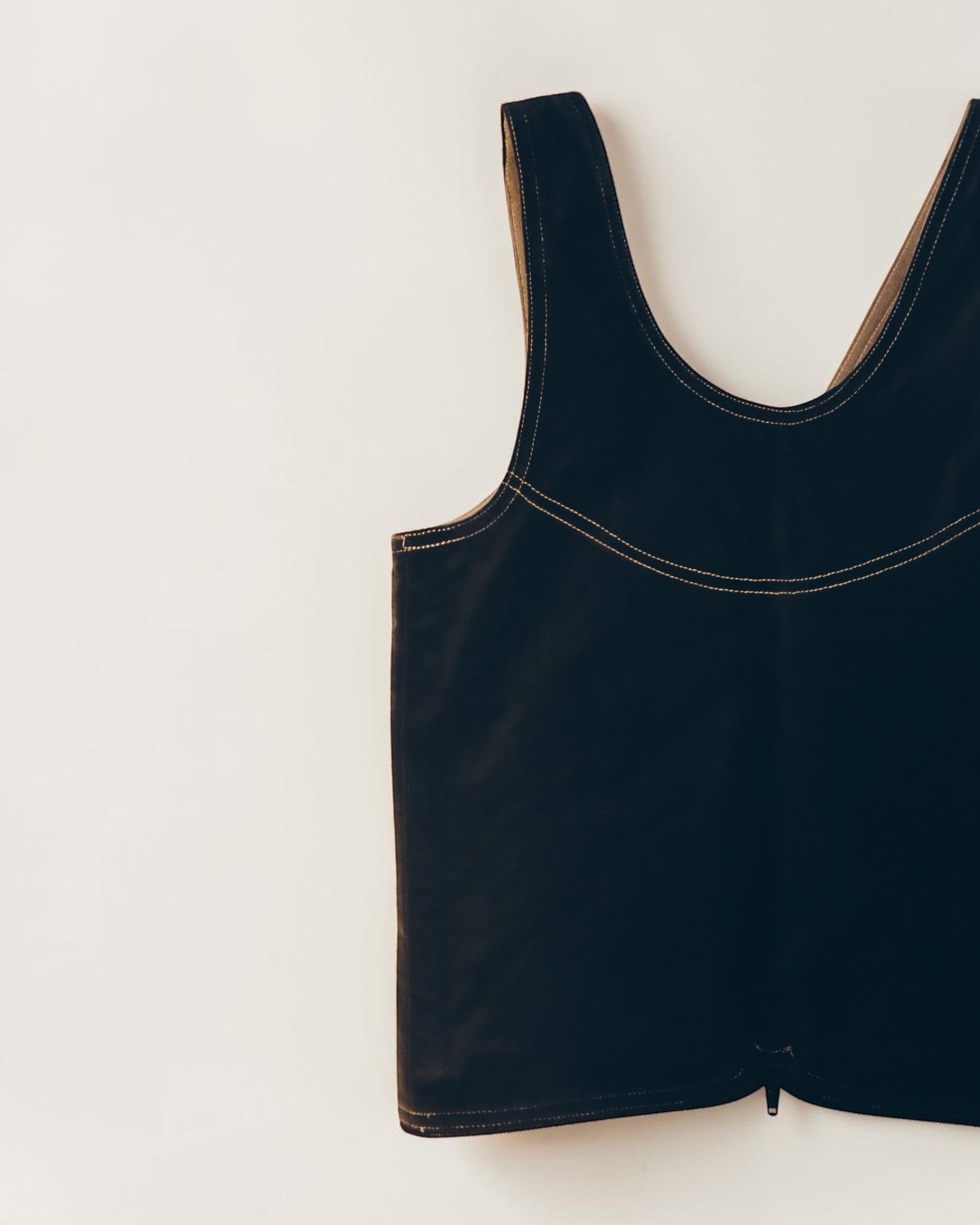 Hue Labs reversible Garden Vest Bag in black upcycled material with contrast stitching and gun metal zipper.