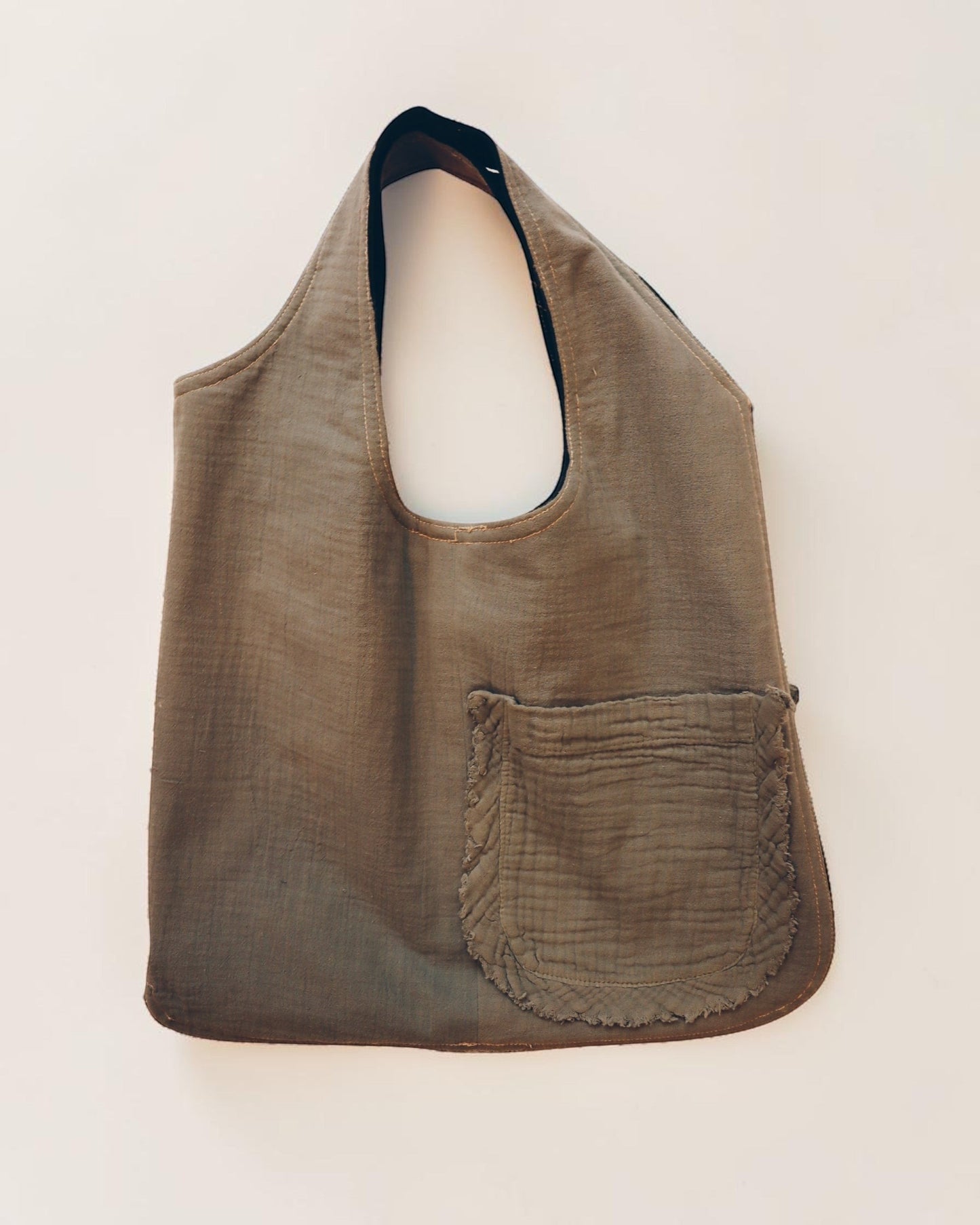 Hue Labs reversible Garden Vest Bag in olive green upcycled fabric with a front pocket and gun metal zipper.
