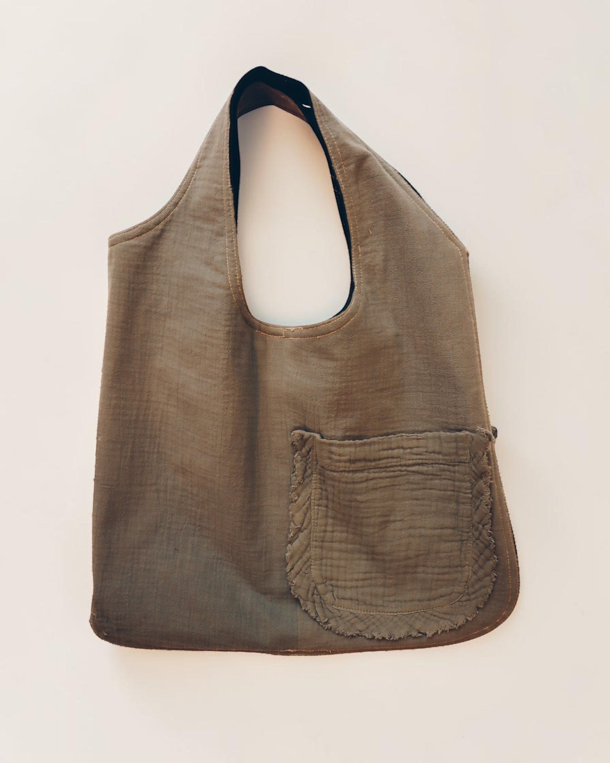 Hue Labs reversible Garden Vest Bag in olive green upcycled fabric with a front pocket and gun metal zipper.