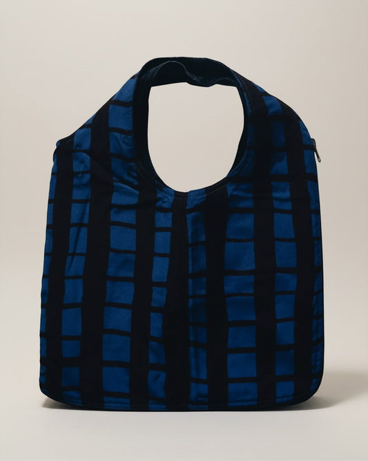 Hue Labs reversible blue and black grid pattern upcycled vest bag with a gun metal zipper