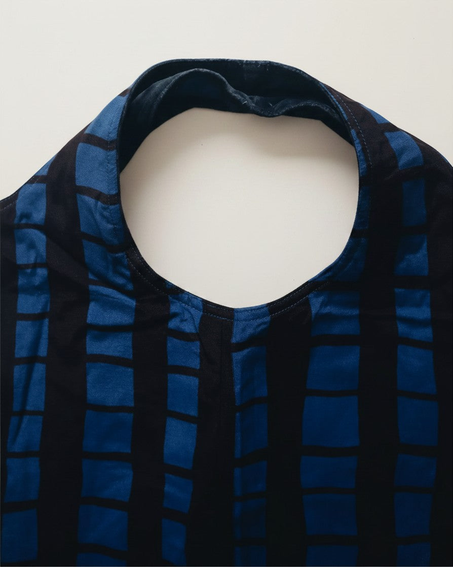 Hue Labs reversible grid blue vest bag made from upcycled materials with a versatile double-use design.