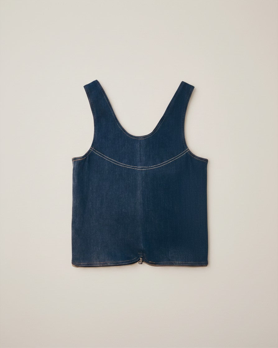 Hue Labs medium wash denim vest bag made from upcycled materials with a gun metal zipper, shown in a flat lay view.
