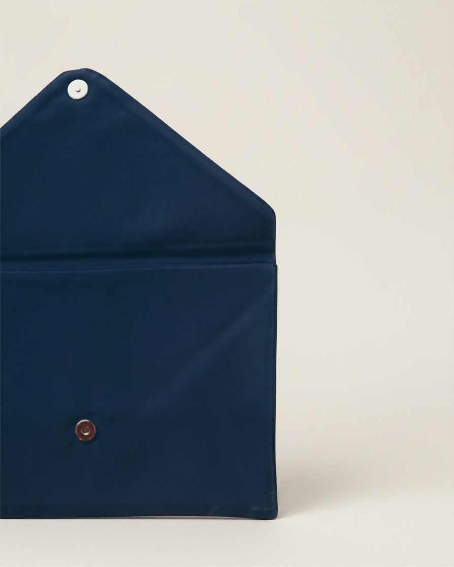 Hue Labs midnight blue envelope clutch made from upcycled cotton with a magnetic snap closure