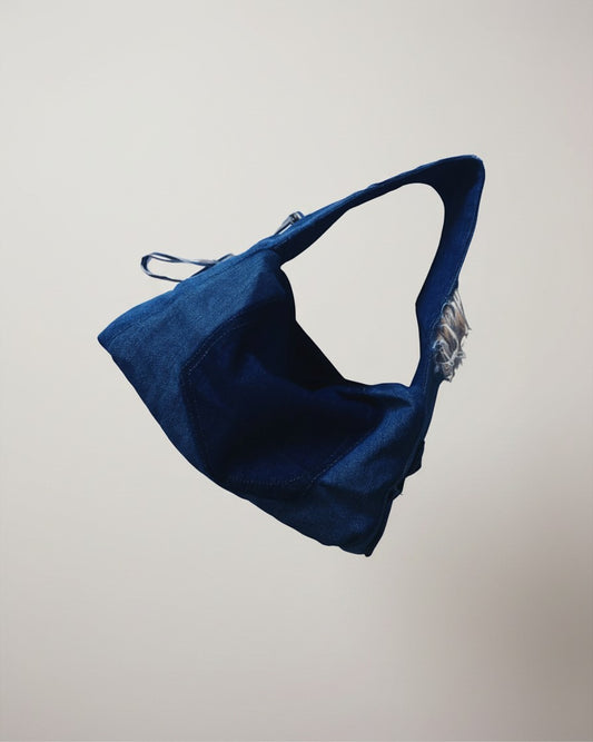 Hue Labs midnight blue distressed denim dumpling shoulder bag with adjustable strap and sturdy base