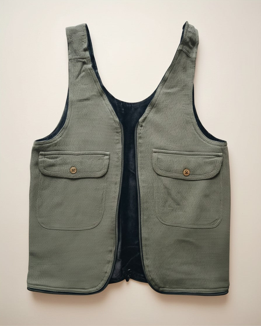 Hue Labs olive green upcycled vest bag with two front pockets, gun metal zipper, and reversible design.