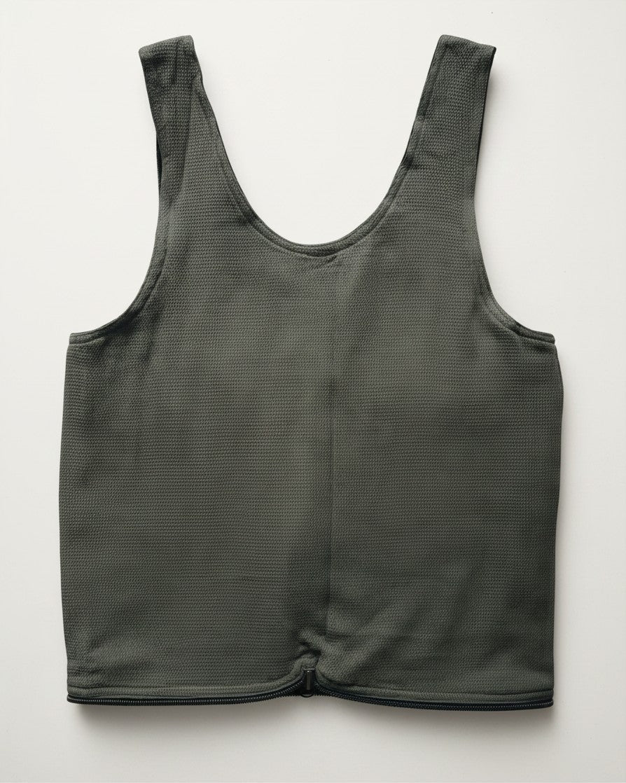 Hue Labs olive green reversible vest bag made from upcycled textured fabric with a gun metal zipper closure.