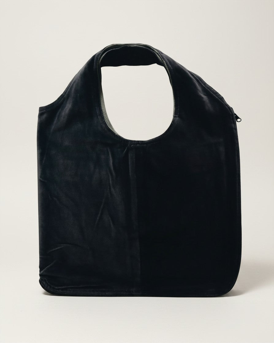 Hue Labs olive vest bag made from upcycled materials, featuring a reversible design and gun metal silver zipper.