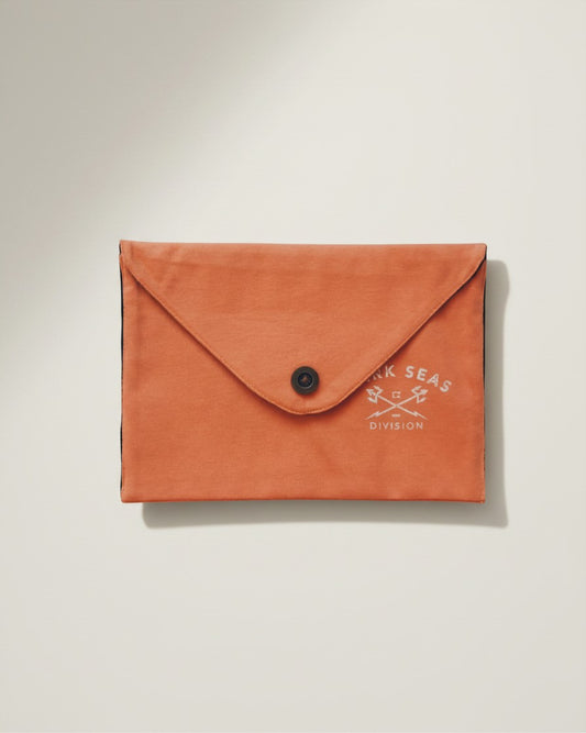 Hue Labs Peach Division envelope clutch made from upcycled orange textile with a magnetic snap closure