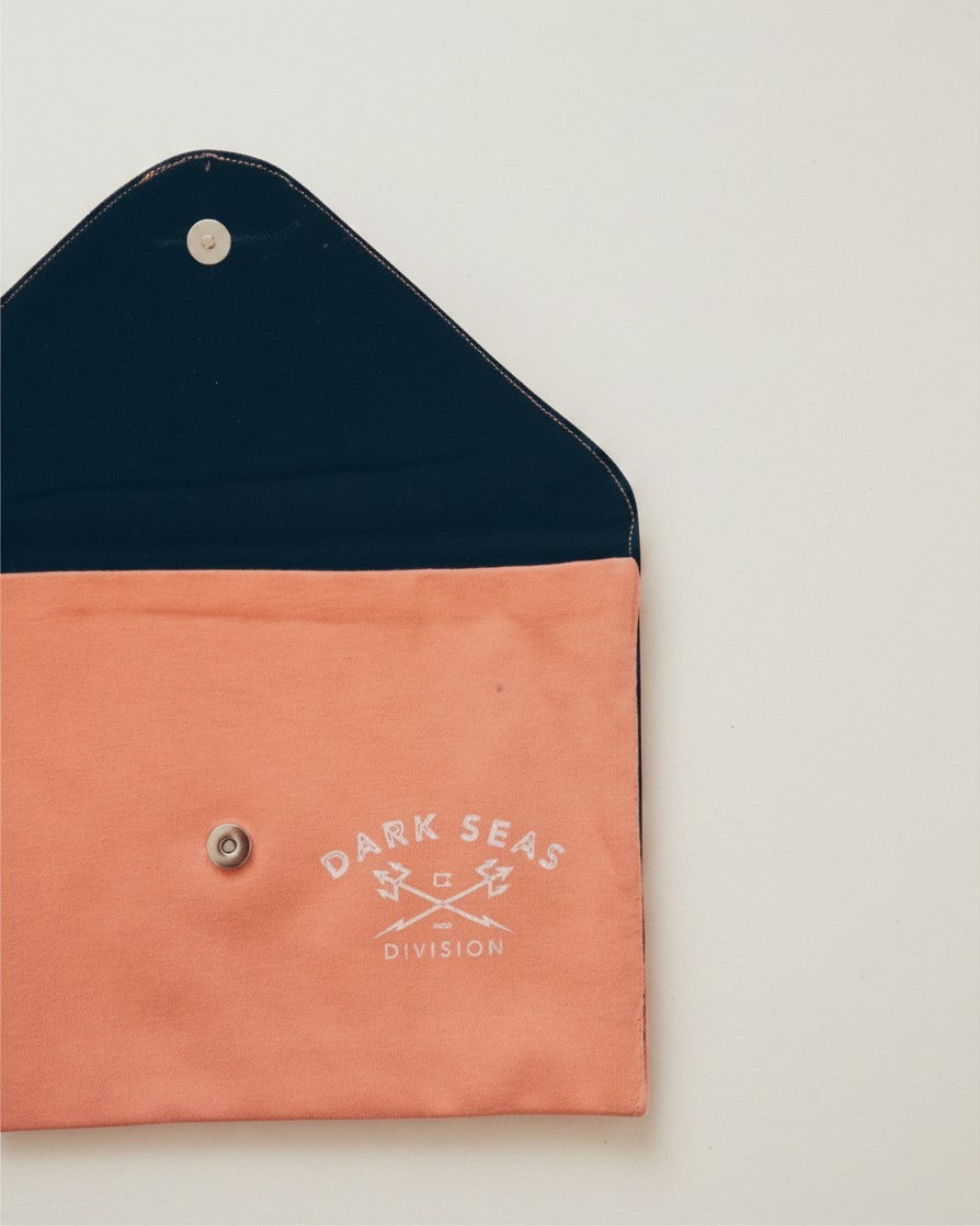 Hue Labs Peach Division envelope clutch made from upcycled peach and navy fabric with a magnetic snap closure.