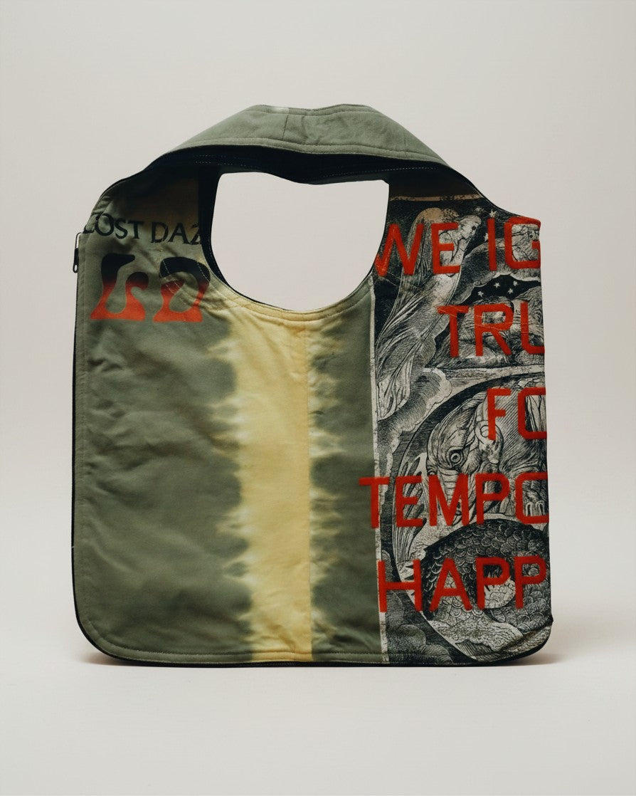 Hue Labs Piña Colada reversible vest bag in olive green with graphic print and red typography on upcycled fabric.