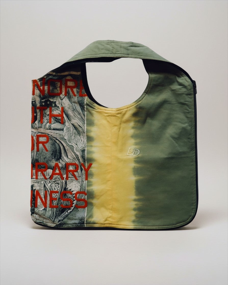 Hue Labs Piña Colada reversible vest bag in olive green and yellow with graphic print and gun metal zipper