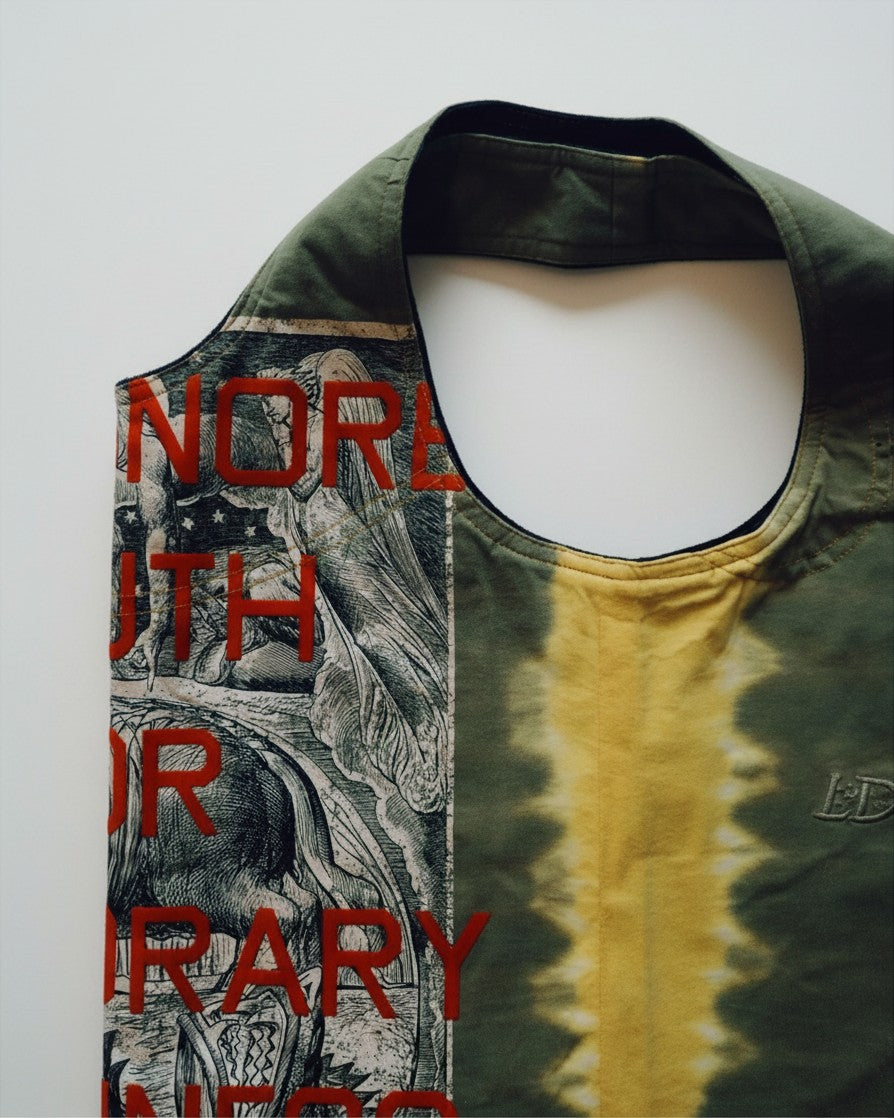 Hue Labs Piña Colada reversible upcycled vest bag in olive green and yellow with graphic print and metal zipper