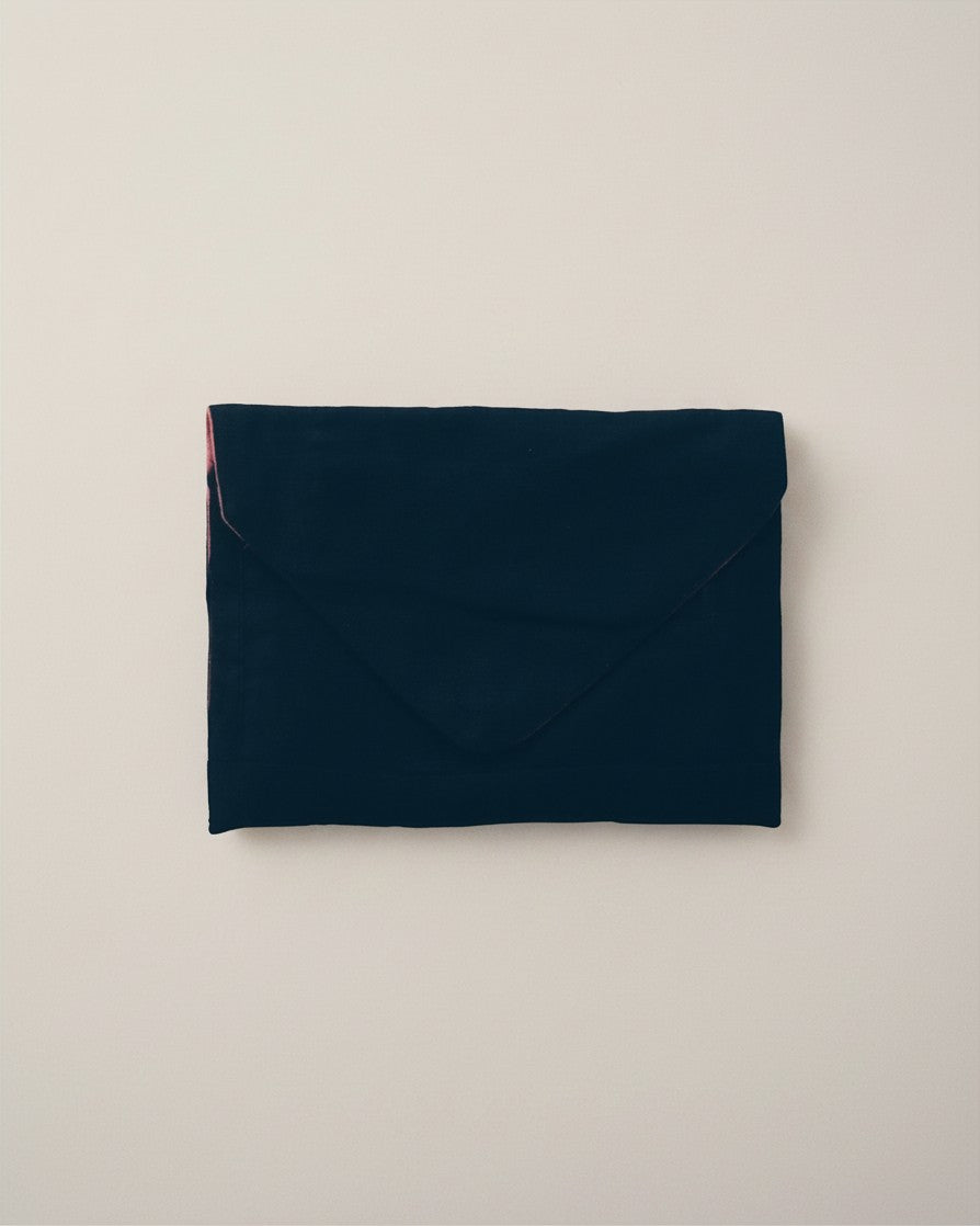 Hue Labs purple slate envelope clutch made from sustainable upcycled textiles with a magnetic snap closure.