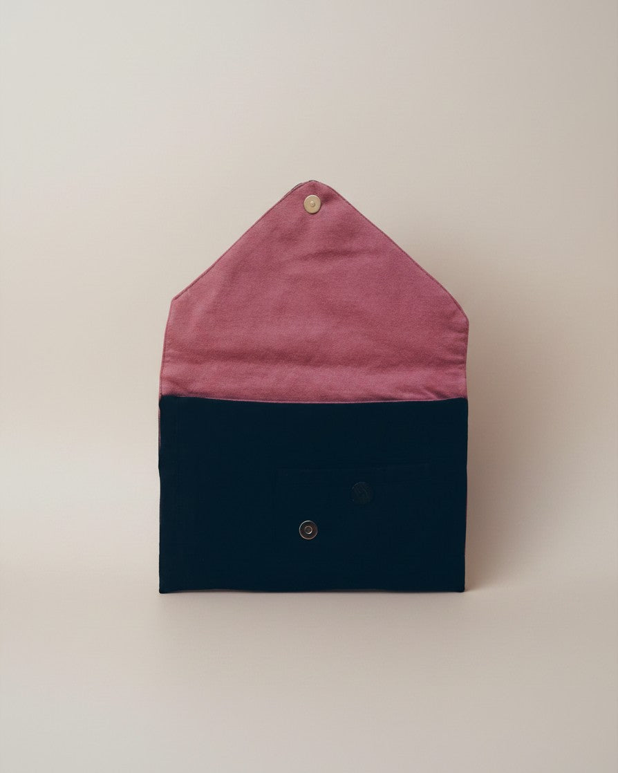 Hue Labs purple slate envelope clutch made from upcycled textiles with a magnetic snap closure, shown open.