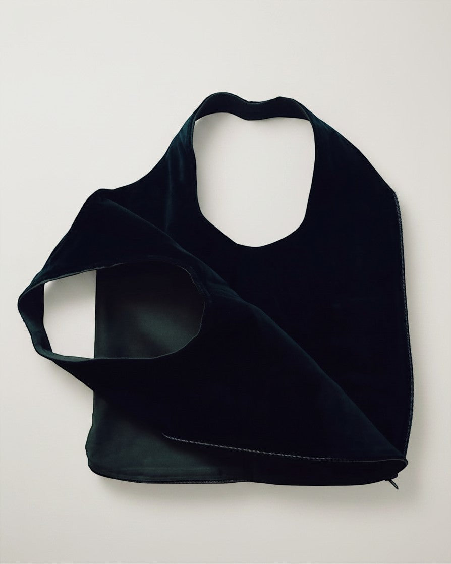 Hue Labs reversible army green vest bag made from upcycled materials with a silver metal zipper