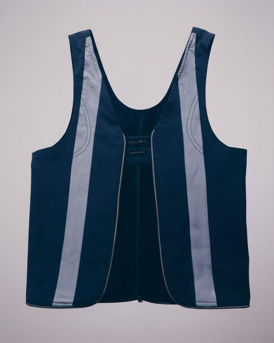 Hue Labs reversible blue stripe vest bag made from upcycled materials with a silver gun metal zipper