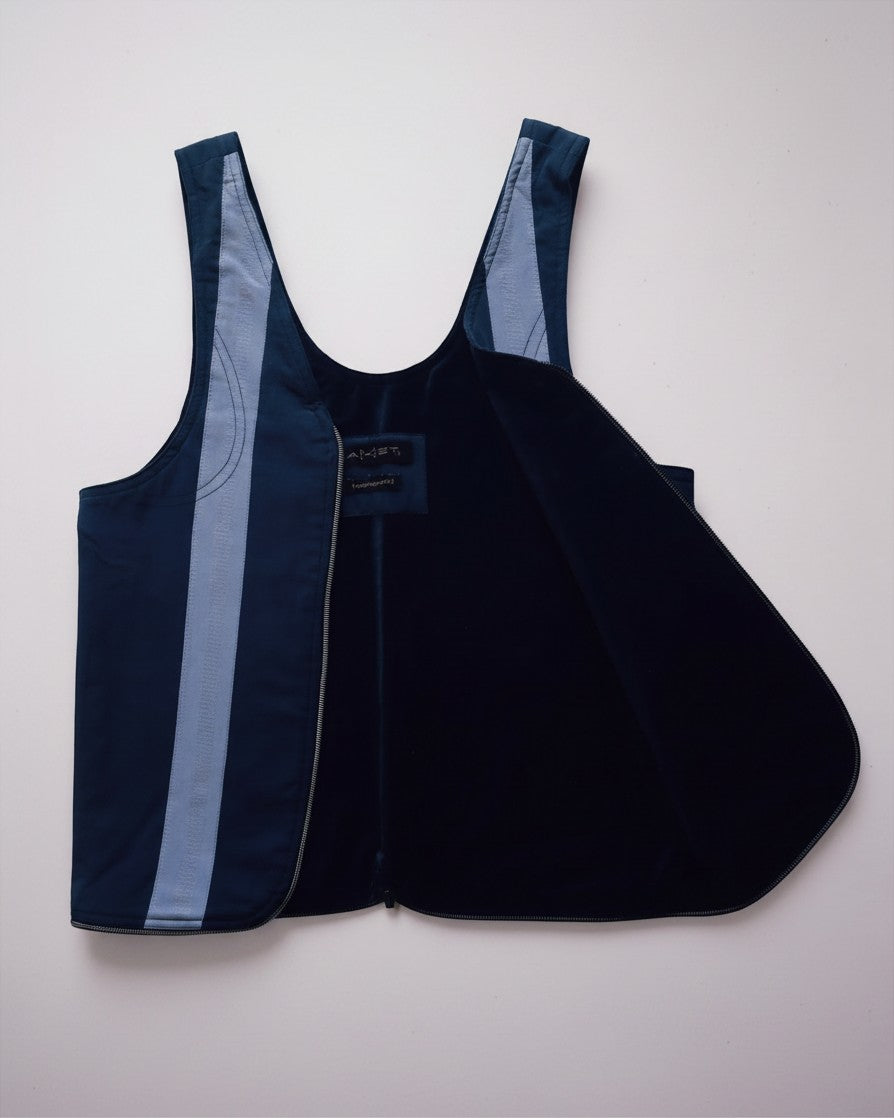 Hue Labs reversible blue stripe vest bag made from upcycled materials with a gun metal silver zipper