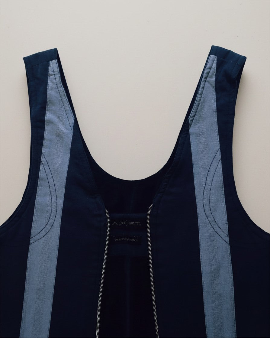 Hue Labs reversible blue stripe vest bag featuring a gun metal silver zipper and handcrafted upcycled fabric design.