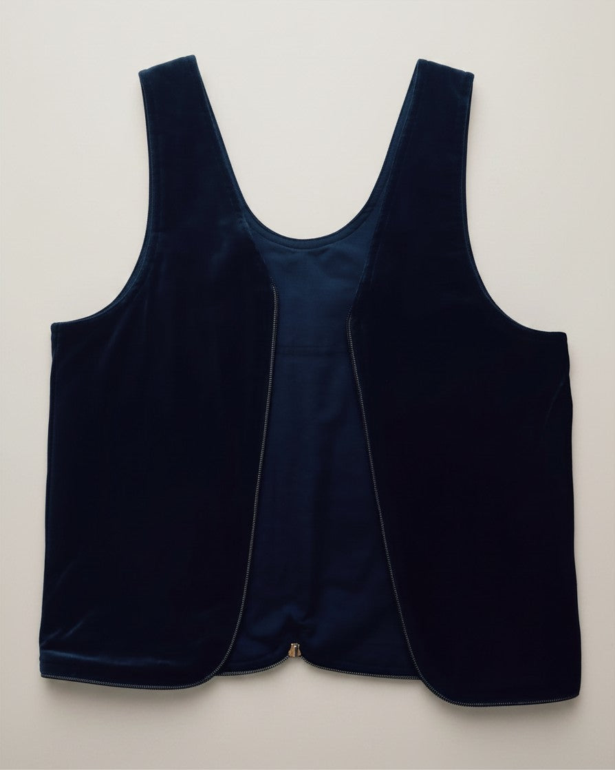 Hue Labs reversible blue vest bag made from upcycled materials featuring a gun metal double direction zipper