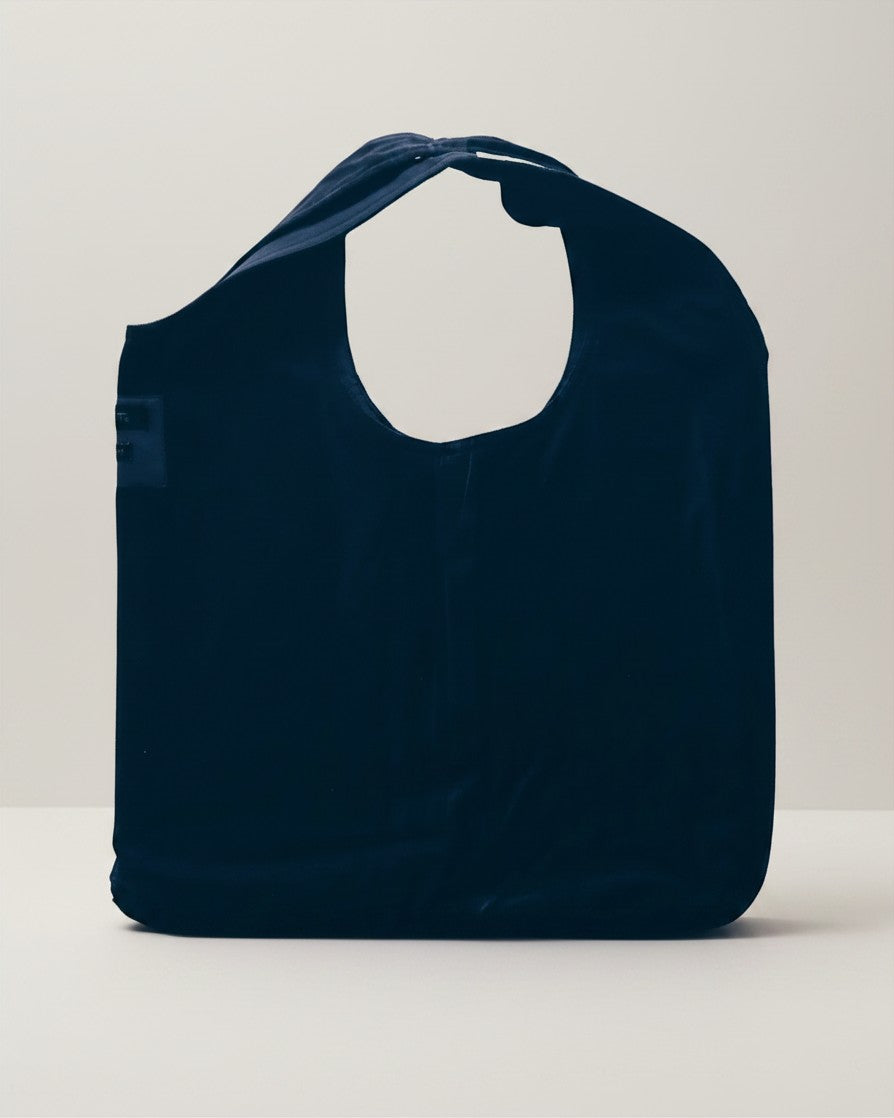 Hue Labs reversible blue vest bag handcrafted from upcycled materials with a versatile double-use design.
