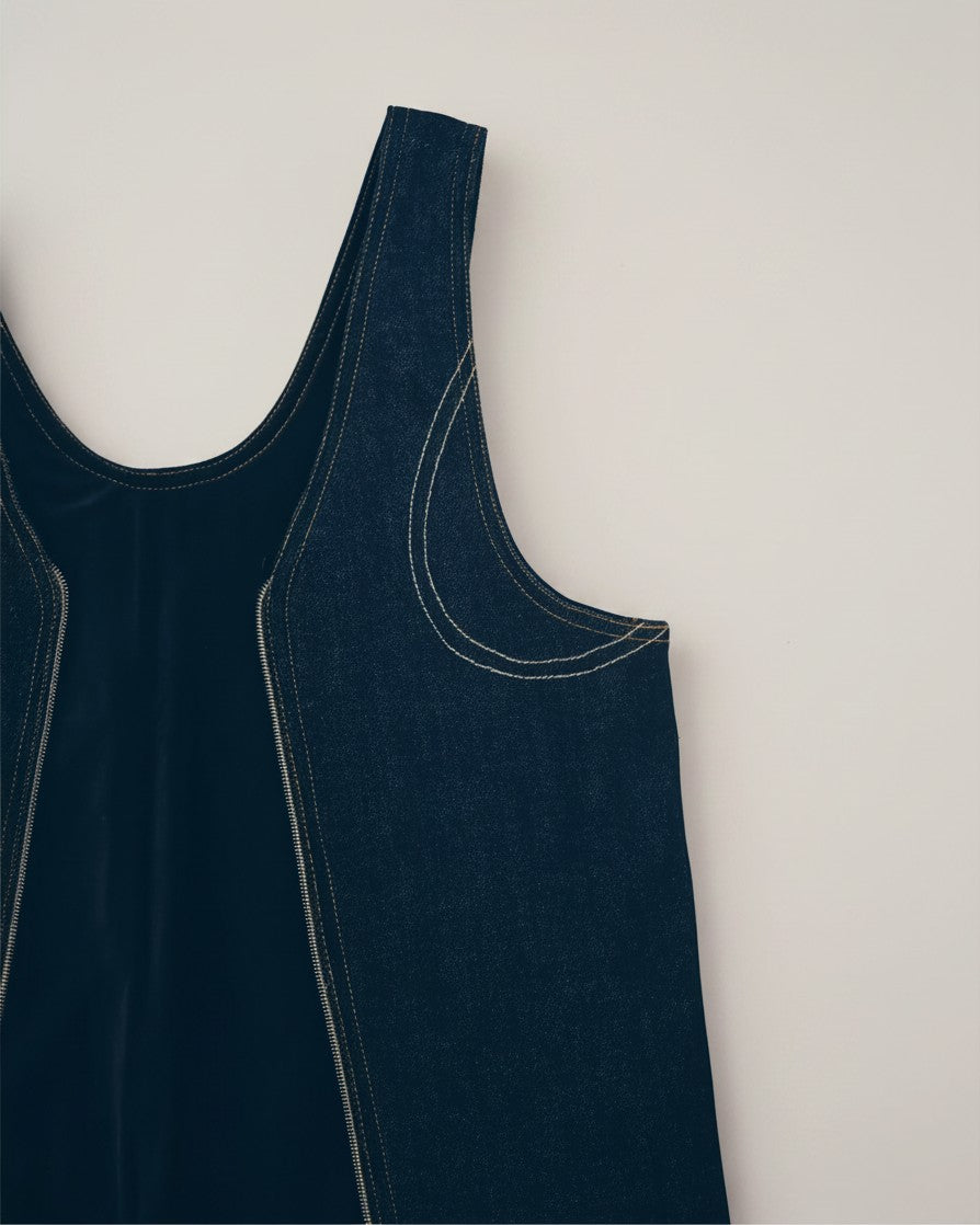 Hue Labs reversible blackout denim vest bag featuring dark blue upcycled fabric and a silver metal zipper detail.