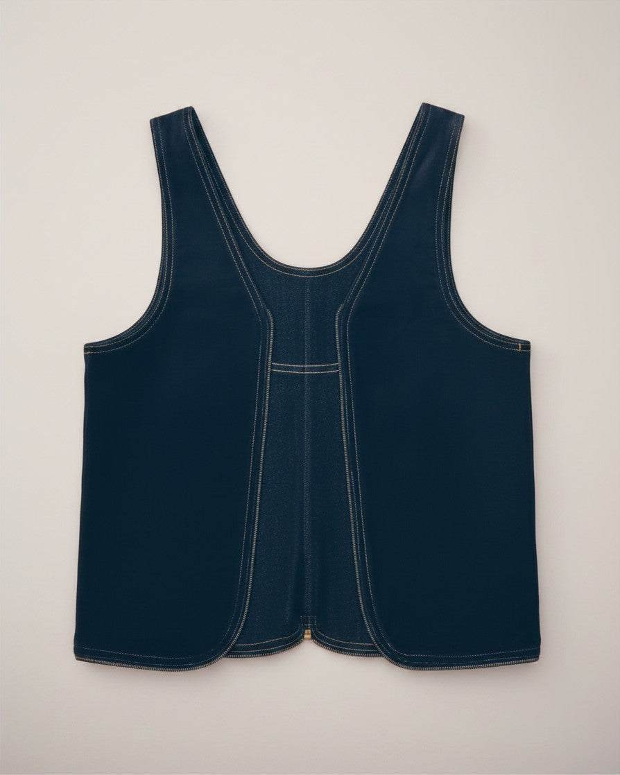 Hue Labs reversible blackout denim vest bag featuring dark blue upcycled fabric and silver metal zipper details.