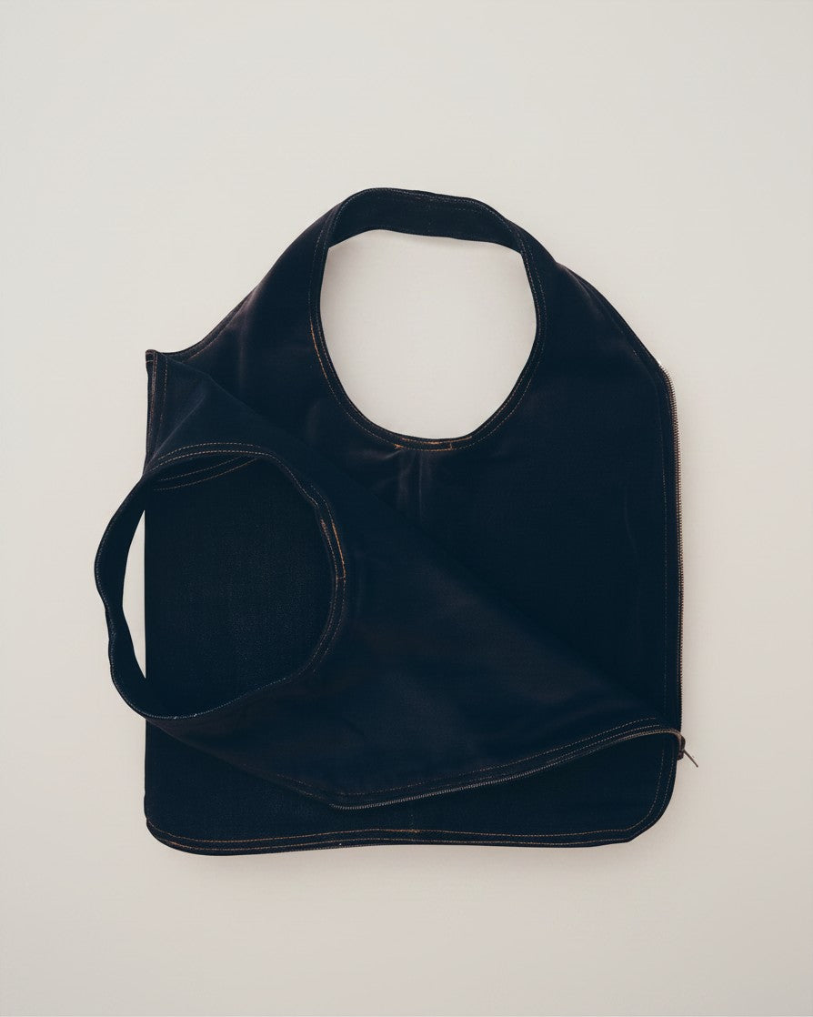 Hue Labs reversible black denim vest bag with gun metal zipper, handcrafted from upcycled materials.