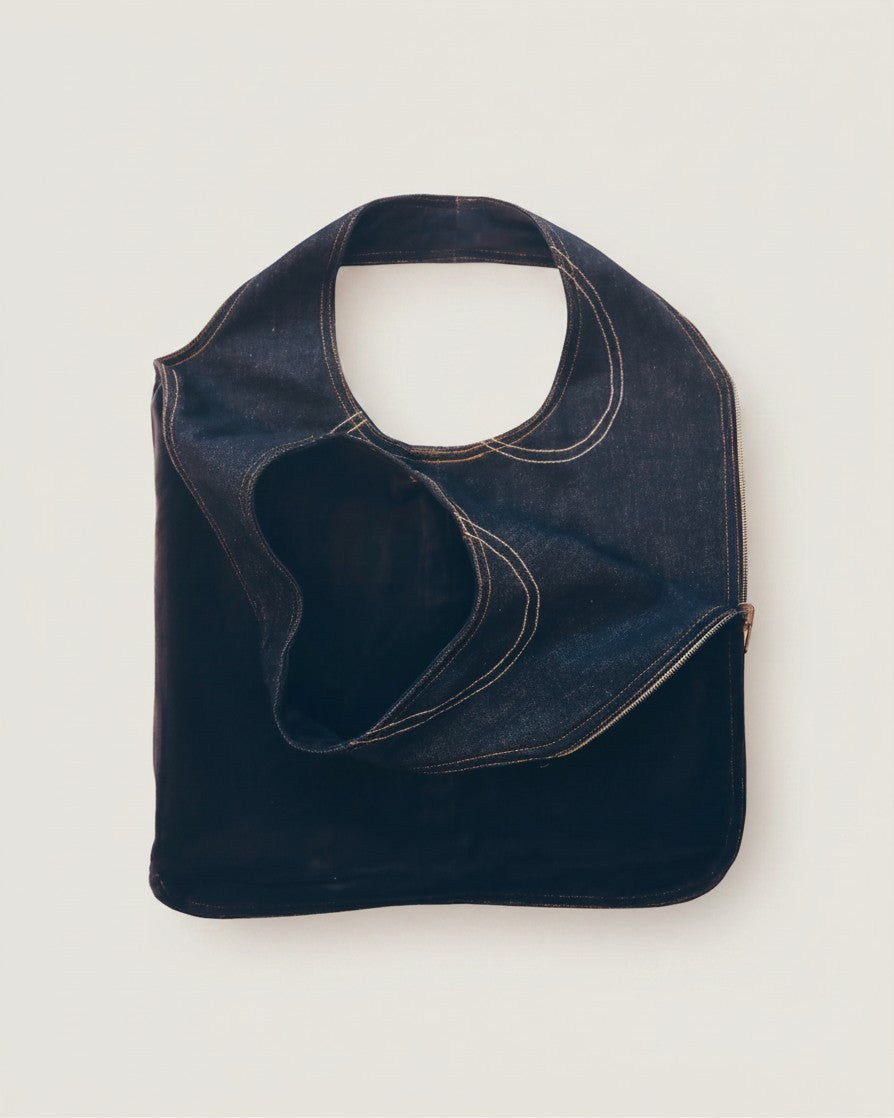 Hue Labs reversible blackout denim vest bag with silver metal zipper, handcrafted from upcycled materials.