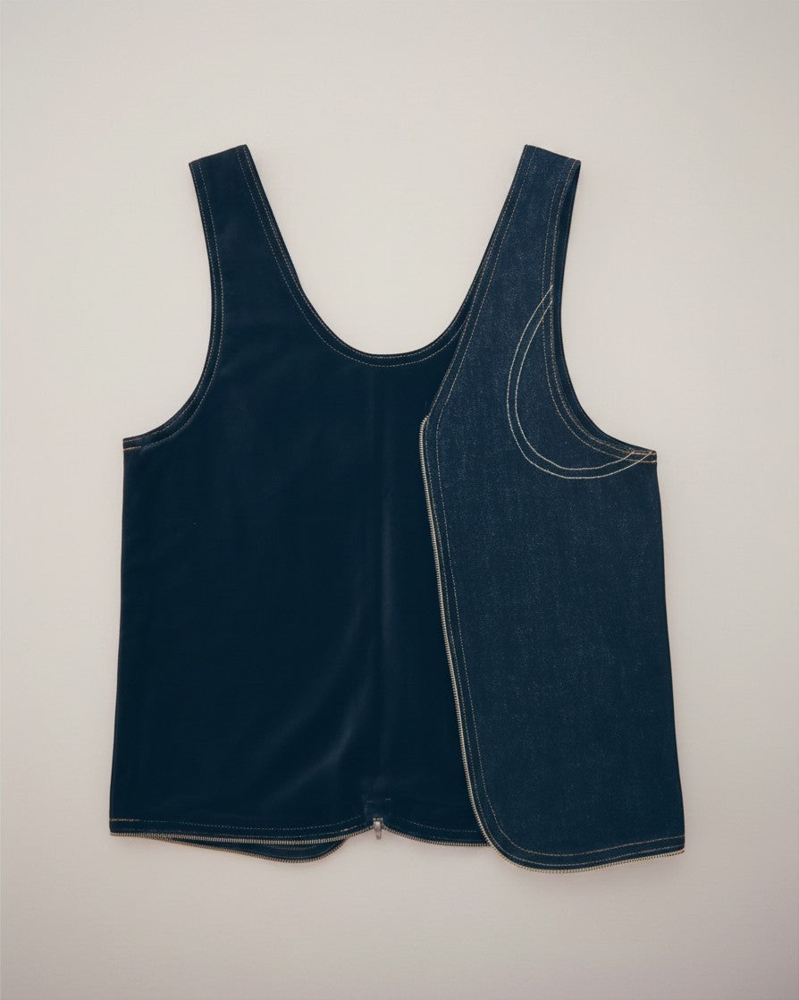 Hue Labs reversible blackout denim vest bag made from upcycled materials with a silver metal zipper.