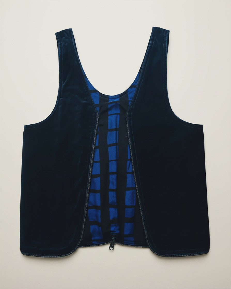 Hue Labs reversible vest bag in navy blue velvet and blue grid pattern fabric with a gun metal zipper