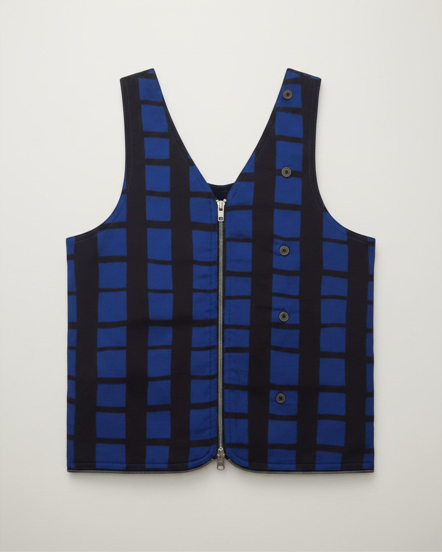 Hue Labs reversible blue and black grid vest bag with a gun metal silver zipper and button details
