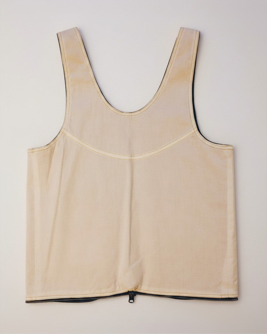 Hue Labs reversible vest bag in beige upcycled fabric with a silver metal zipper, shown from the plain side.