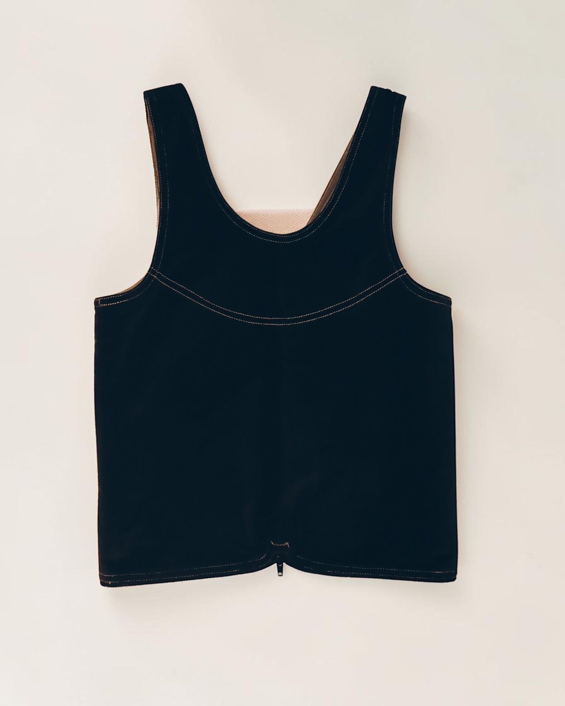 Hue Labs reversible black vest bag made from upcycled materials with a gun metal double direction zipper.