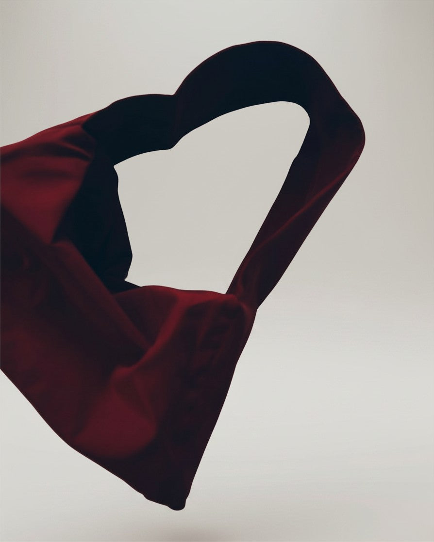Hue Labs scarlet red dumpling shoulder bag made from upcycled materials with a soft, compact, and sculptural shape.