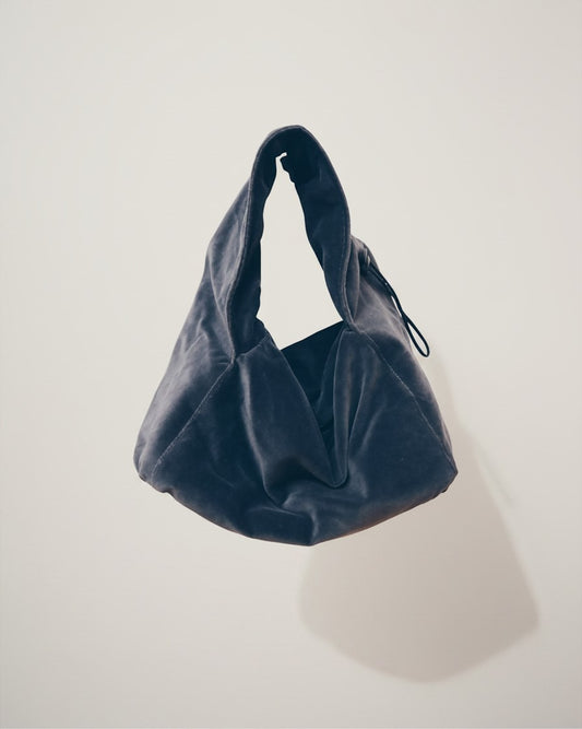 Hue Labs silver dumpling shoulder bag made from upcycled materials with an adjustable strap and magnetic closure