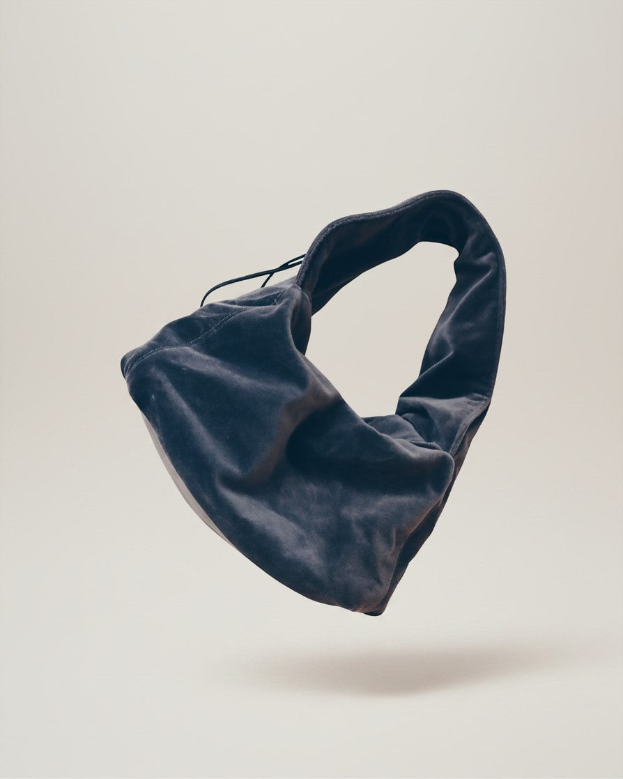 Hue Labs silver dumpling shoulder bag made from upcycled materials with an adjustable strap and magnetic closure